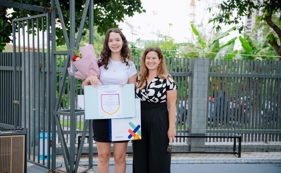 Milana Gurova AVE Academy student celebrating her 100% score and Top in the World award.